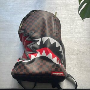 SprayGround Shark bite backpack ( USED )